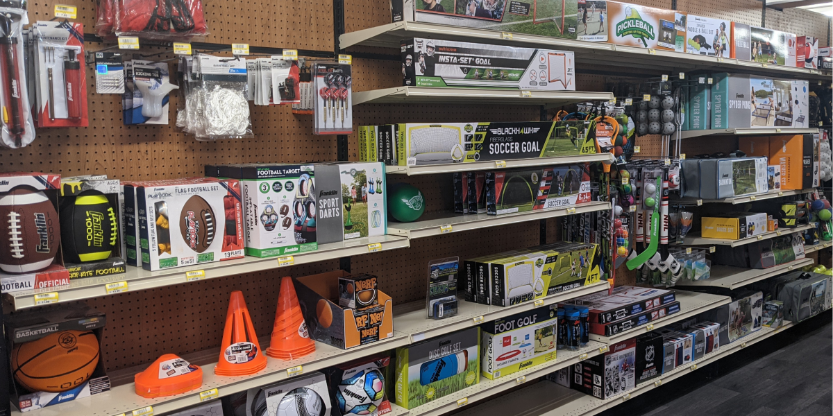 balls, cones and sports equipment at sporting goods store